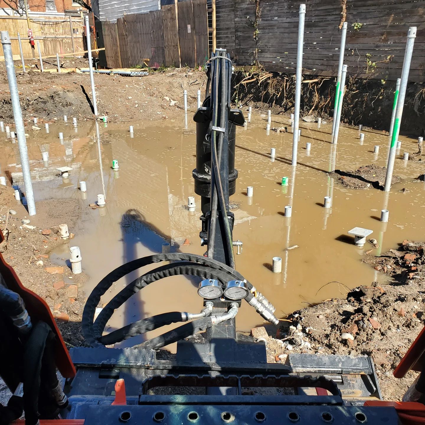 A grid of installed helical piles cut to elevation